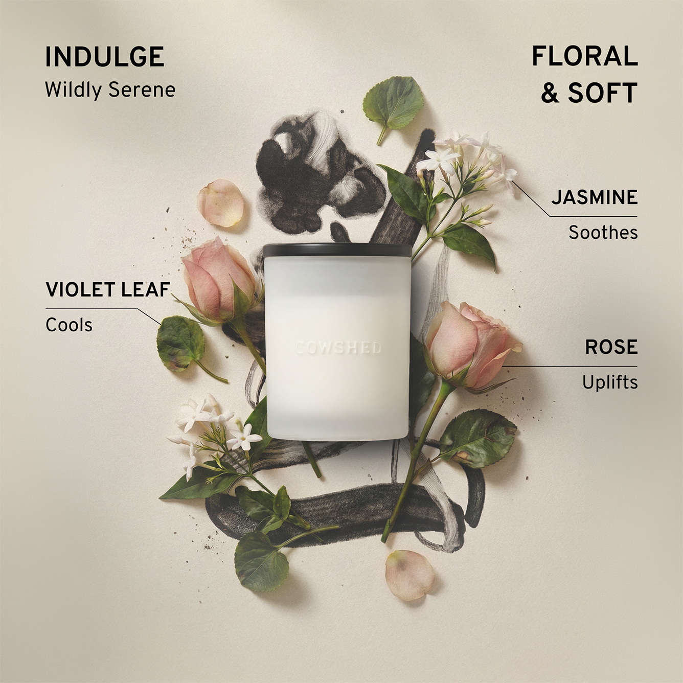 Candle with floral elements and text describing its floral and soft fragrance notes on a light background