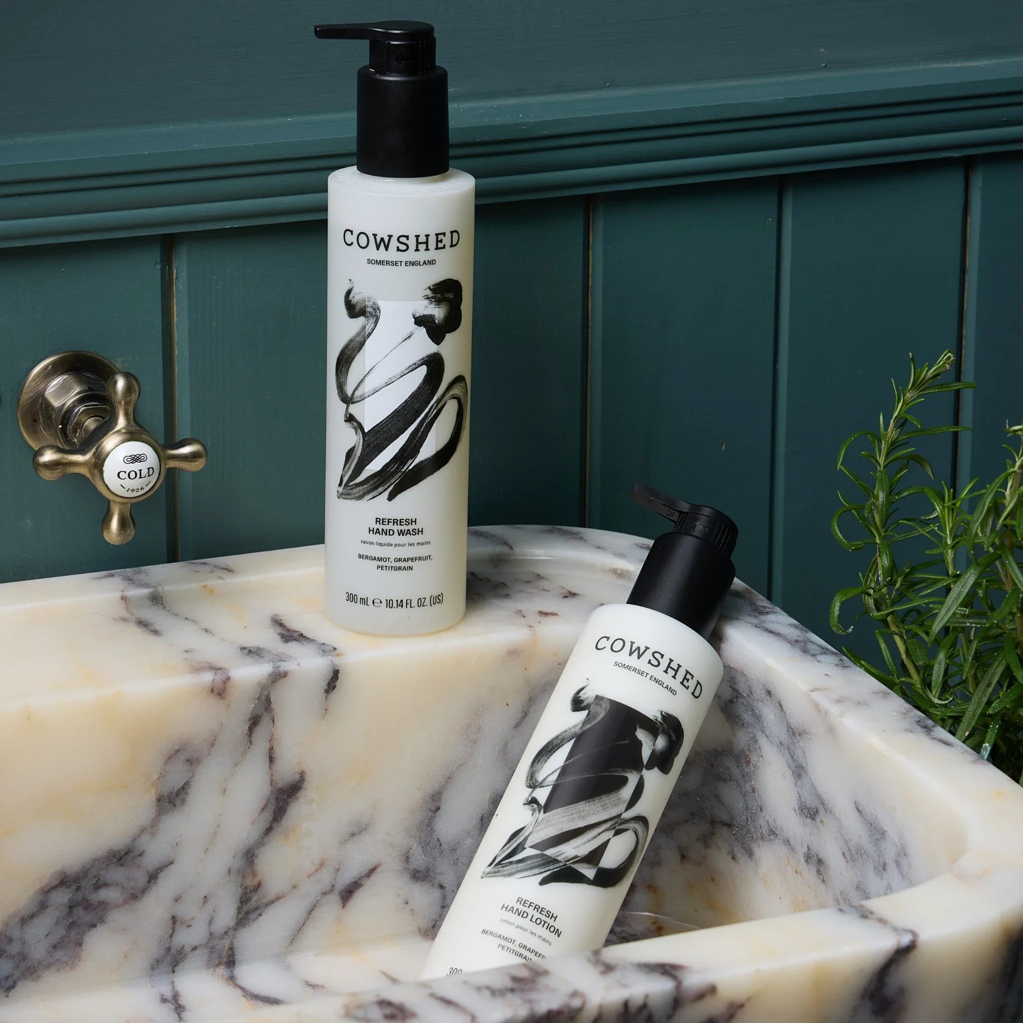 Refresh hand wash & lotion in a black & white marble sink