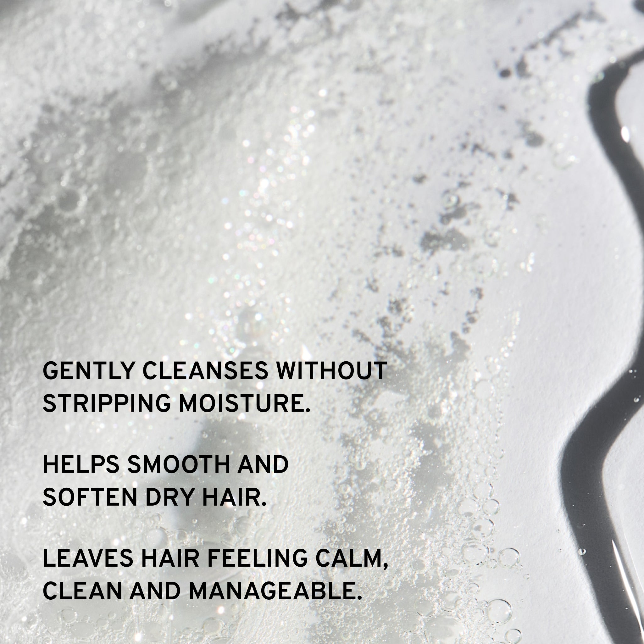 Close-up of a shampoo bubbles with text describing gentle cleansing benefits