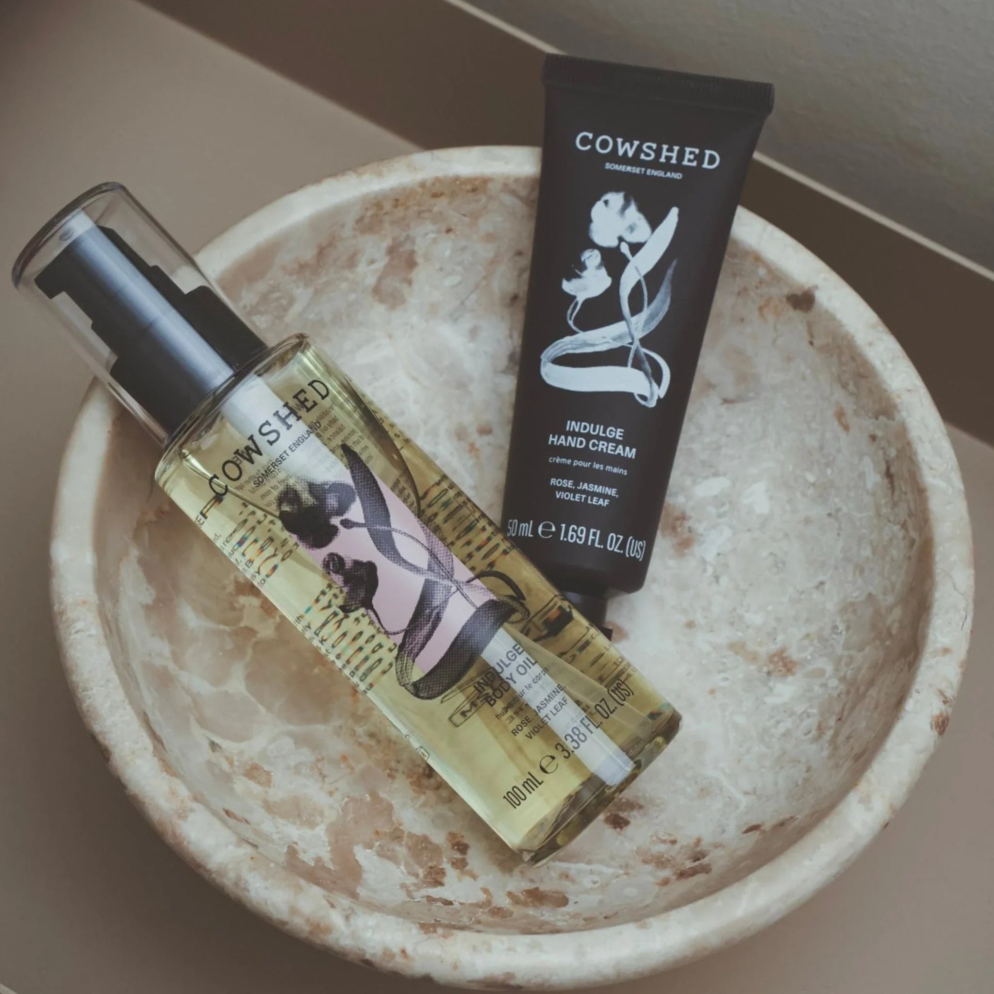 Cowshed Indulge hand and body products in a bowl
