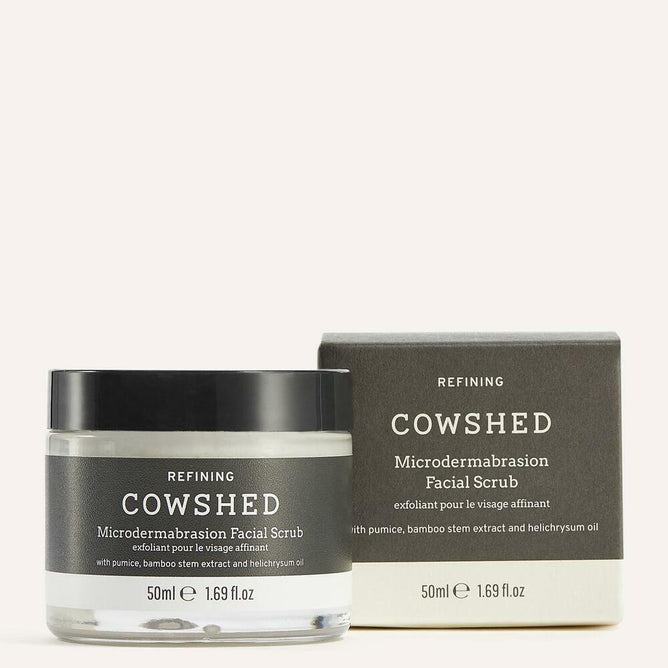 A jar and box of Cowshed Microdermabrasion Face Scrub, with product information and branding visible.
