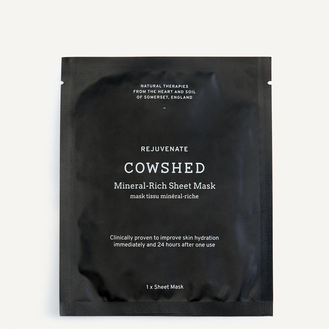 A black packaged mineral-rich sheet mask by Cowshed, with text detailing the product name and benefits.
