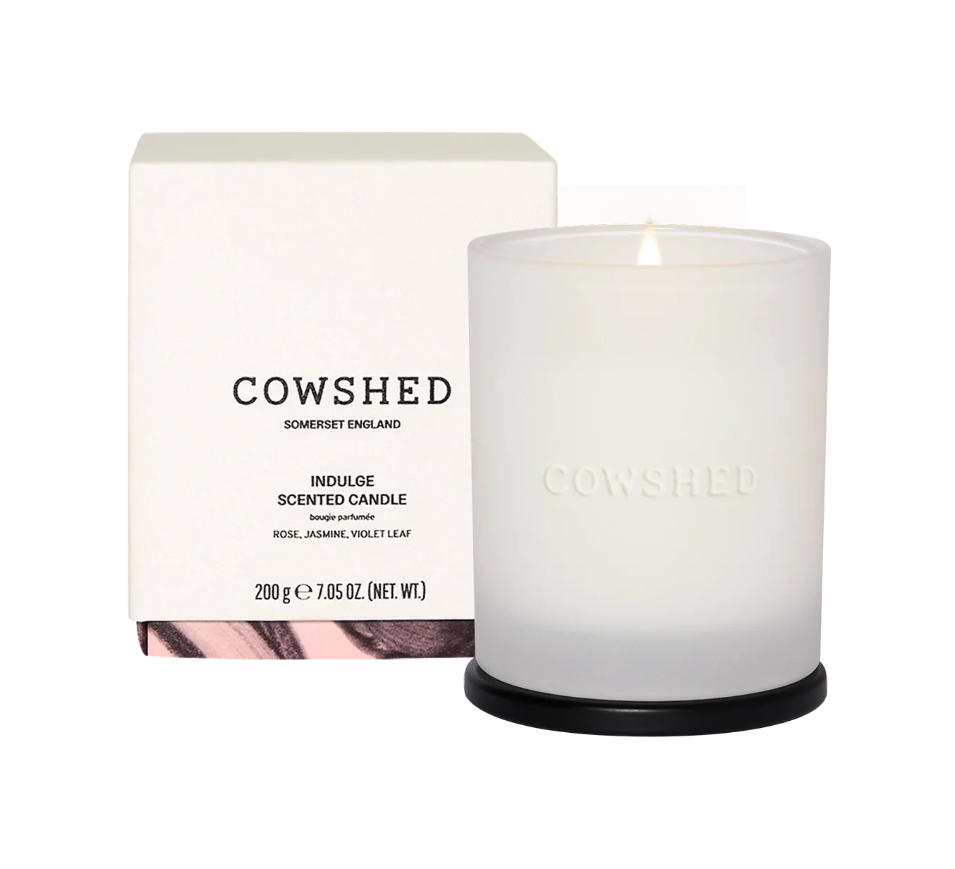 Cowshed candle and packaging on a white background