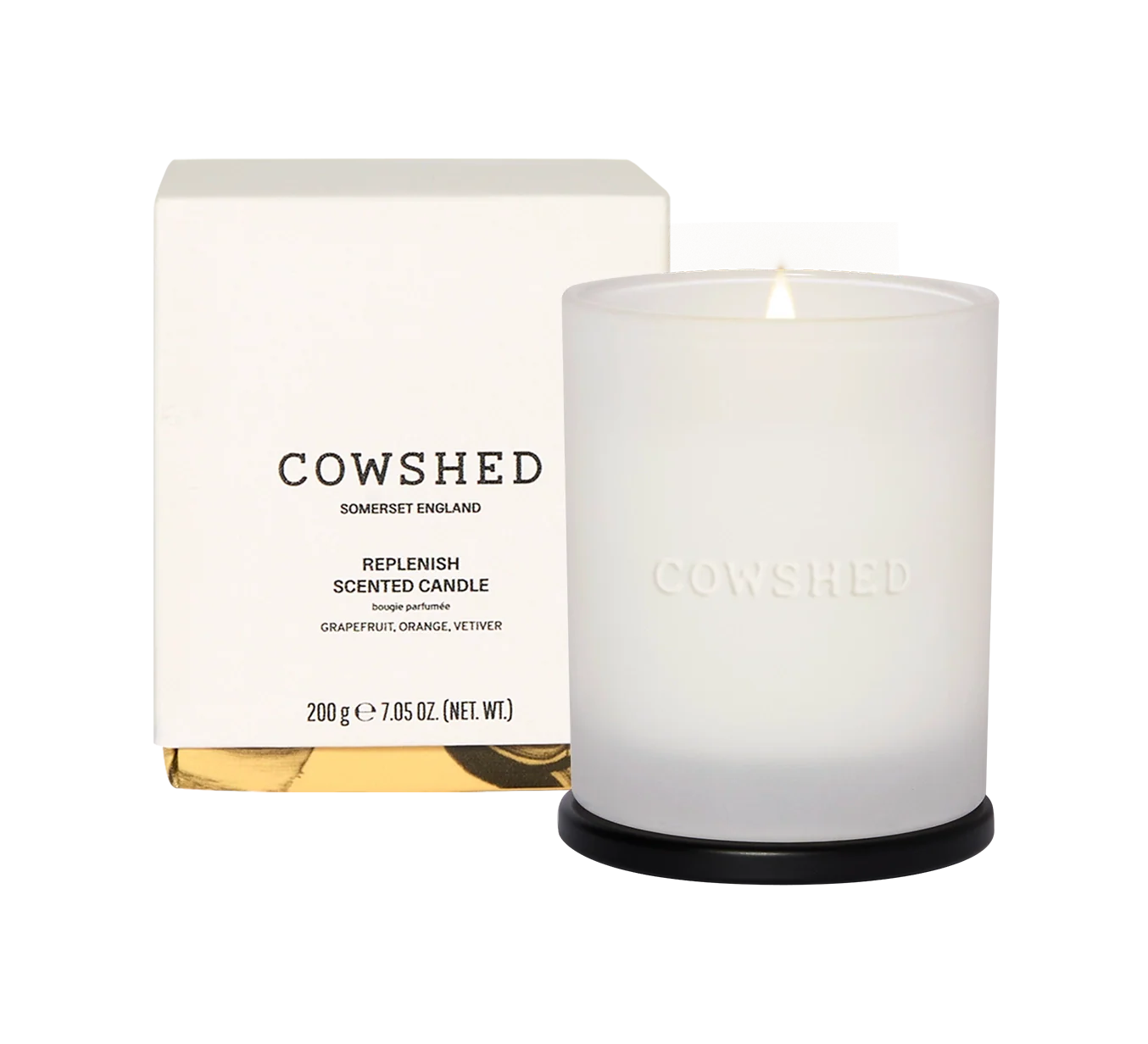 Cowshed candle and packaging on a white background